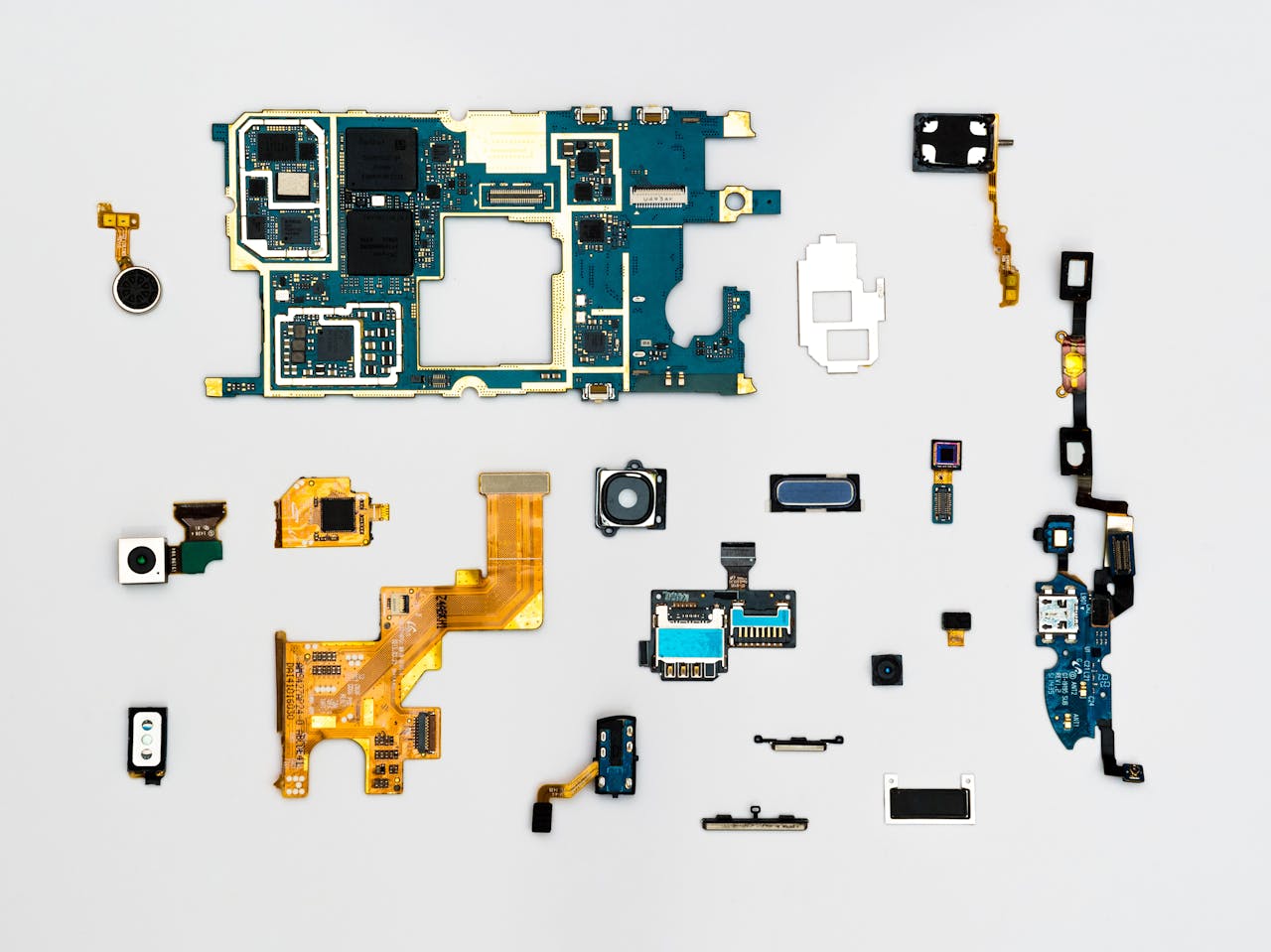 gallery-01 Exploded view of smartphone components showcasing intricate technological design.