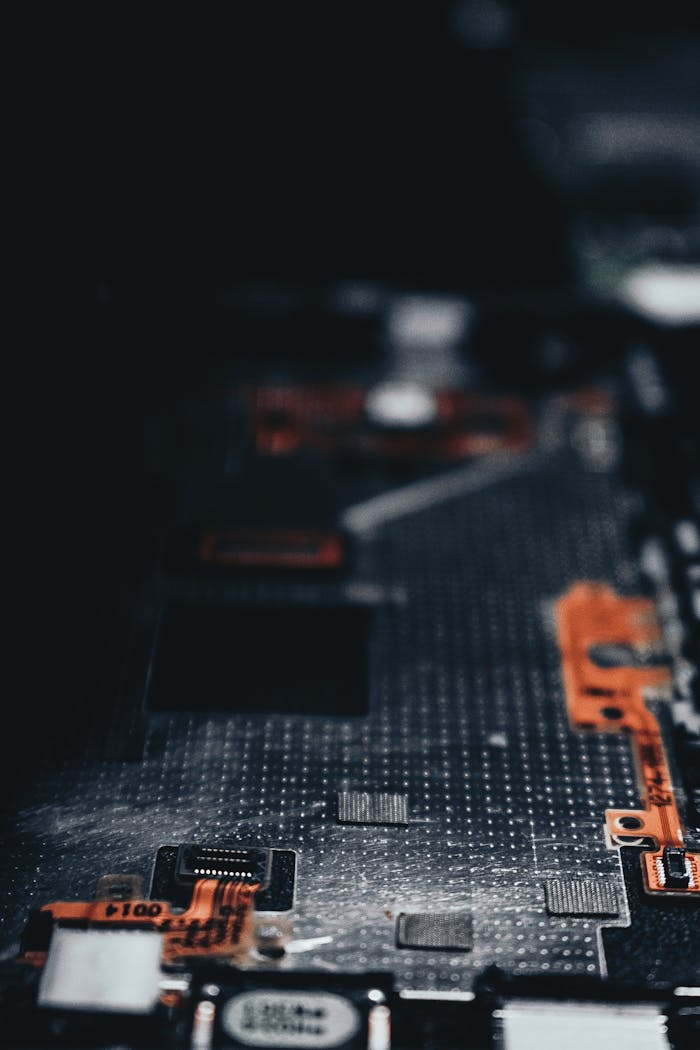 trusted-partner Close-up of a dark circuit board showcasing electronic components and connections.